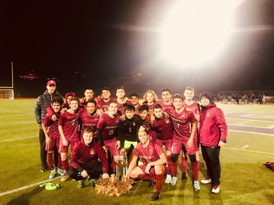 The varsity boys soccer team flash dazzling smiles with a root they laboriously dug up together.