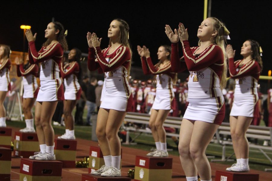 Cheer gets the crowd hyped up at the homecoming football game against Oceanside High School (October 4th). 
