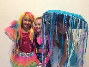 Alyssa Mandell (9) happily poses in her homemade jellyfish costume alongside Lauren Buckingham (9) and Reagan Barnum (9).   