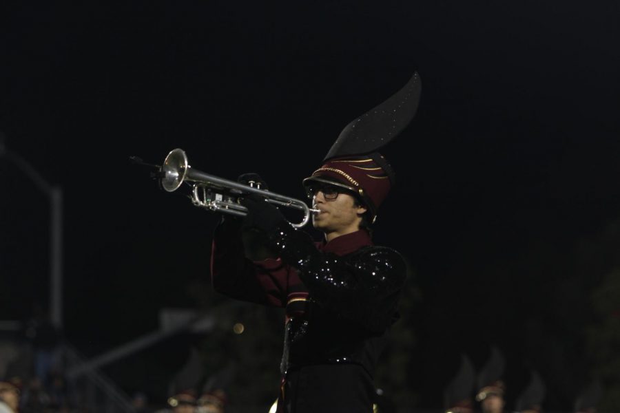 Eban Covarrubbias (11) plays a trumpet solo at discovery bowl halftime. 
