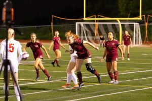 Jade Griffing Jarvis (12) headers the ball in their CIF game against Mt. Carmel in an attempt to gain control of the ball and lead. 