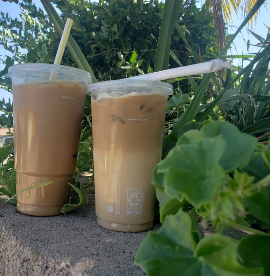 Two iced vanilla coffees sit in the sun, ready to be enjoyed.