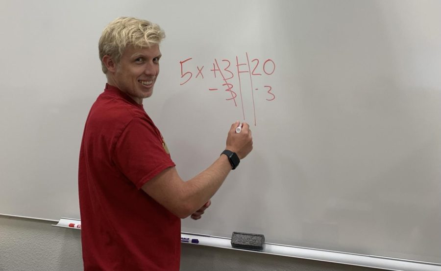 Mr.+Krahel+is+solving+an+algebra+problem+on+a+whiteboard.