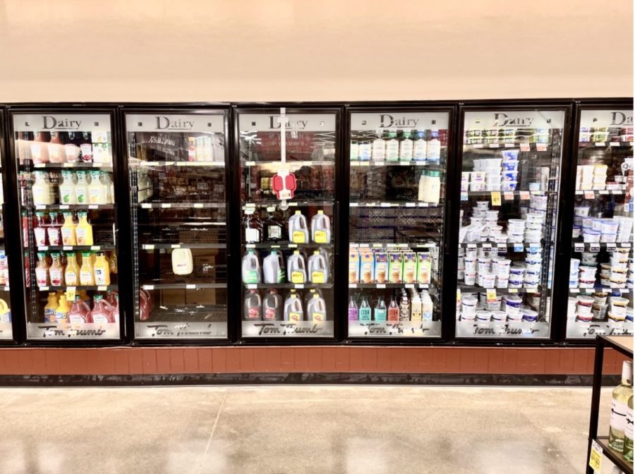 Empty+refrigerator+shelves+at+a+grocery+store