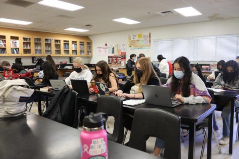 students sitting in chemistry class working on their Chromebooks