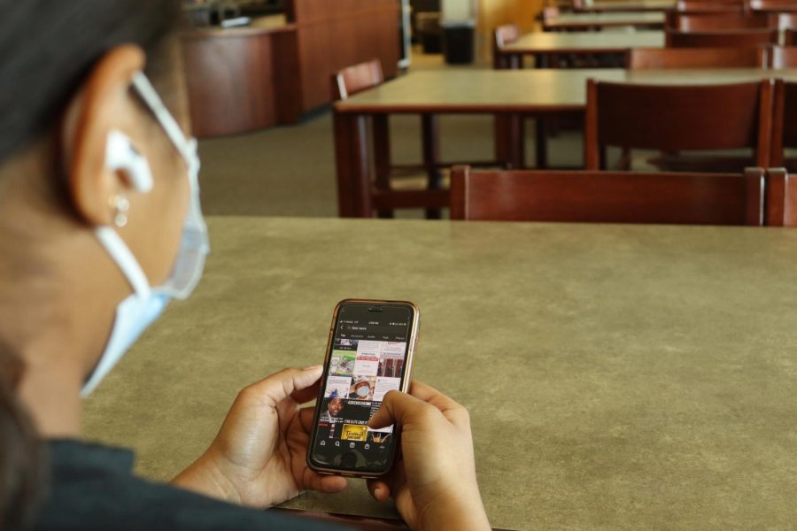 A Mission Hills student scrolling through their social media feed.