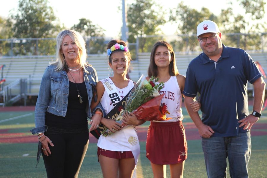 Mayce Kinney poses with her family on her senior night