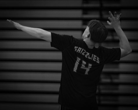 Senior Jimmy Knox serving for the Grizzlies