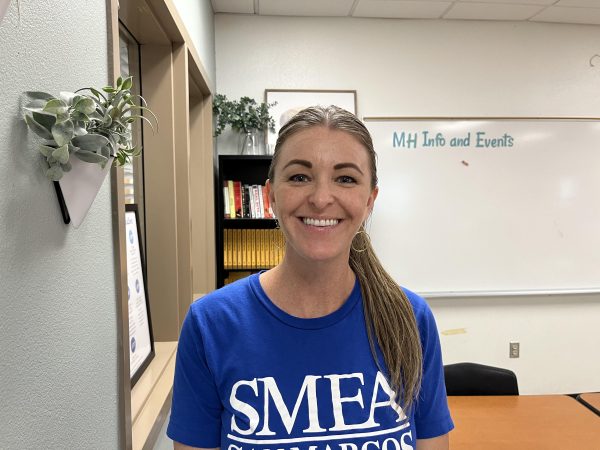 Alecia Markgraf smiling widely in her classroom