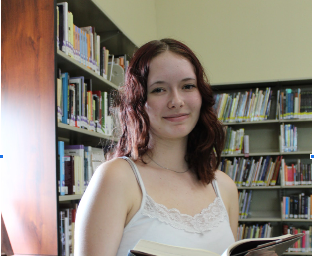 Clara Byrne (freshman) enjoys one of her favorite hobbies: reading.