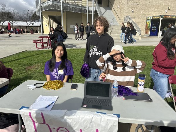 Key Club booth during club rush on Jan. 23 at lunch, featuring Dieu-Thien Vu, the president of the club, and two fellow members.