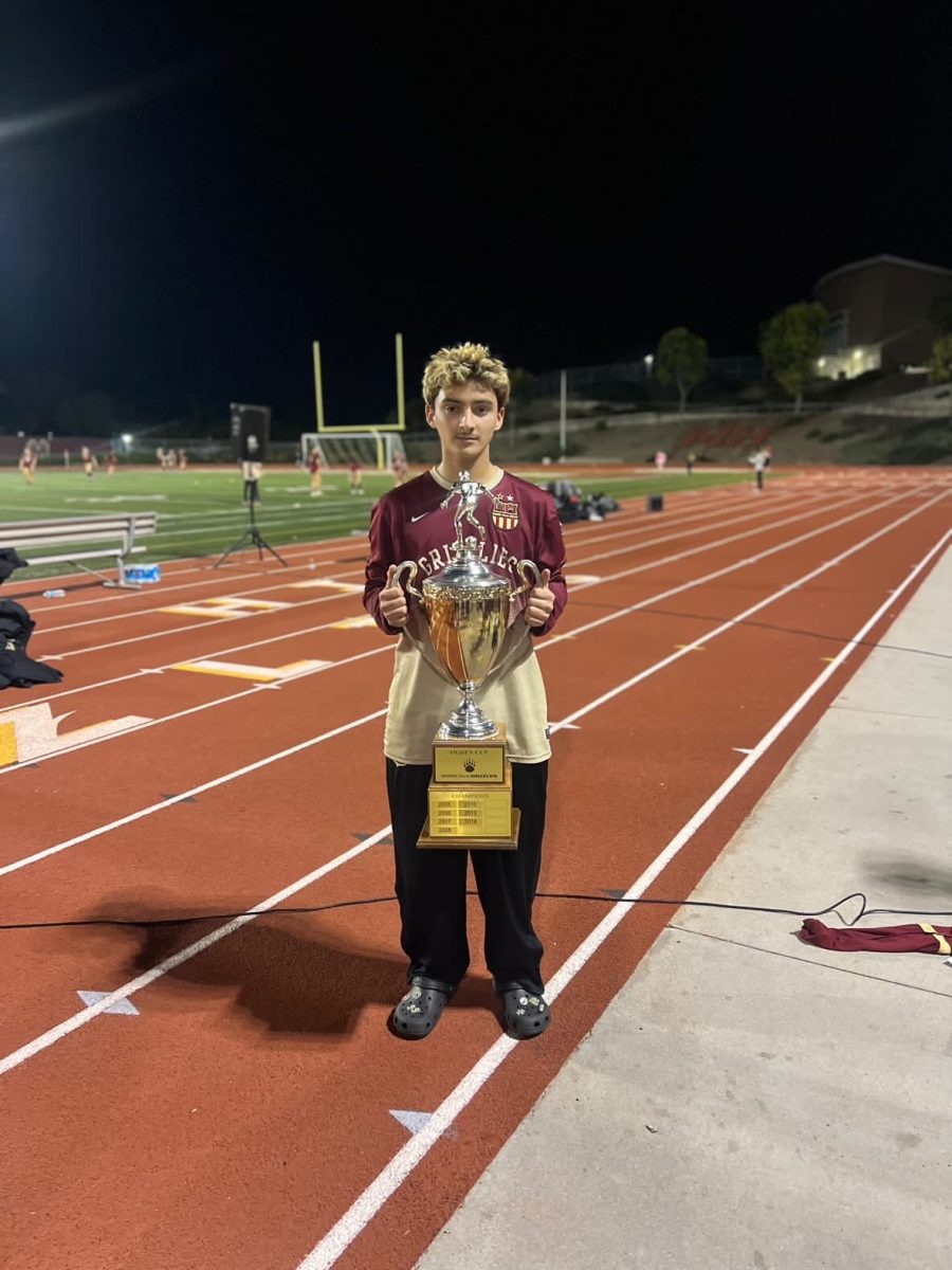 Gavyn Golub holding the Ogden Cup trophy after beating rivals San Marcos