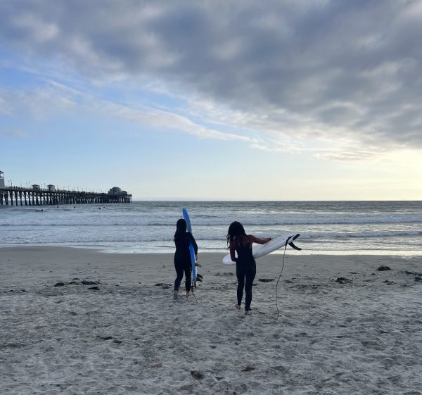 Two surfers are hitting the waves. In Oceanside beach, July 6th Maddy Donlon and Genevieve Saito went to ride the waves. Genevieve says, ¨The feeling of sitting on the waves is unexplainable.¨
