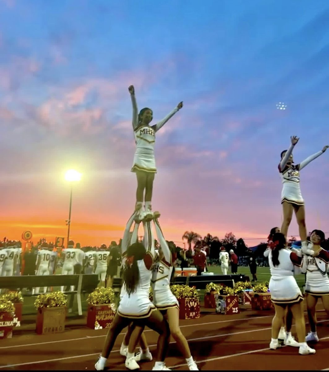 Stephanie Hernandez looks back on this moment when she pulled a stunt during the game. This specific football game was one of my favorites in the last four years because of this stunt and the sunset in the background, said senior Hernandez.