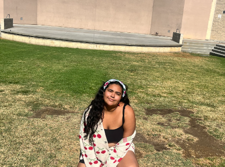 Lia Figueroa, 25' is pictured sitting outside her school theater, connecting with nature and living in an environment she knows best.
Photo Creds: Damian Porter